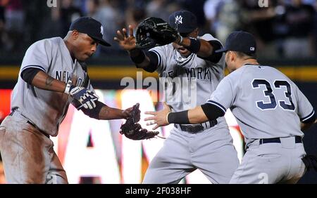 From left, New York Yankees' Anthony Rizzo, Aaron Judge and Giancarlo  Stanton celebrate in the locker room after the Yankees defeated Cleveland  Guardians in Game 5 of an American League Division baseball