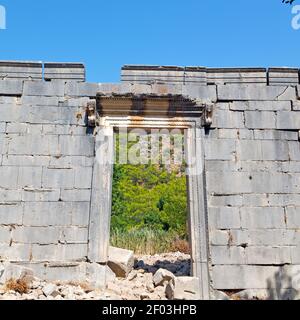 Olympos   bush gate  in  myra  the      old column  stone  construction asia greece and  roman temple Stock Photo