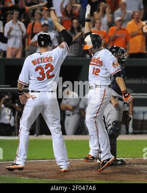 Baltimore Orioles' Matt Wieters (32) celebrates in the dugout