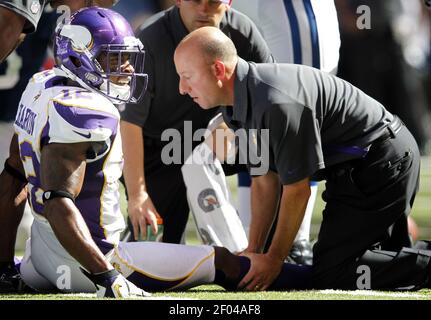 Head athletic trainer Eric Sugarman attends to Minnesota Vikings