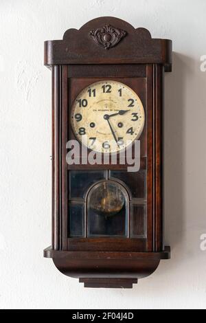 Antique wall clock, Holguin, Cuba Stock Photo