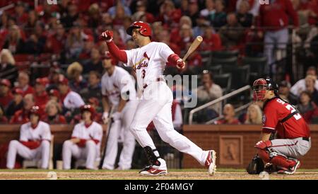 St. Louis Cardinals' Carlos Beltran straps on his batting gloves