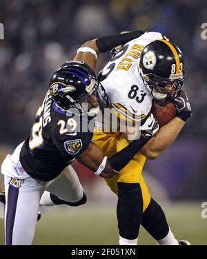 Pittsburgh Steelers Heath Miller (83) breaks a tackle by Oakland Raiders  Kevin Burnett (L) on an eight yard pass play from Steelers Ben  Rothlisberger in the fourth quarter at O.co Coliseum in