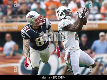 Miami Dolphins safety Chris Clemmons (30) celebrates a tackle during third  quarter action against the New England Patriots at Sun Life Stadium  December 2, 2012 in Miami, Florida. The New England Patriots