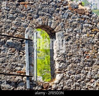 Olympos   bush gate  in  myra  the      old column  stone  construction asia greece and  roman temple Stock Photo