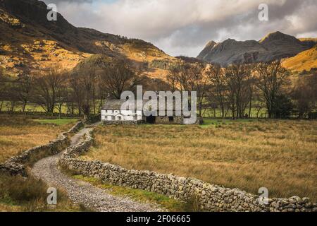 Fell Foot Farm in Little Langdale with the Langdale Pikes behind Stock Photo