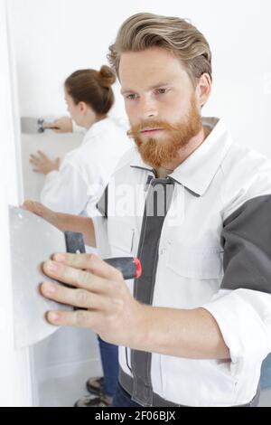 male worker with a spatula in his hand Stock Photo