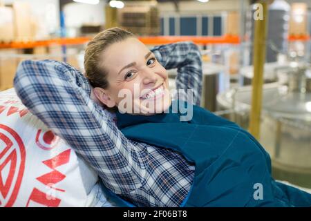 young woman looking happy on the factory Stock Photo