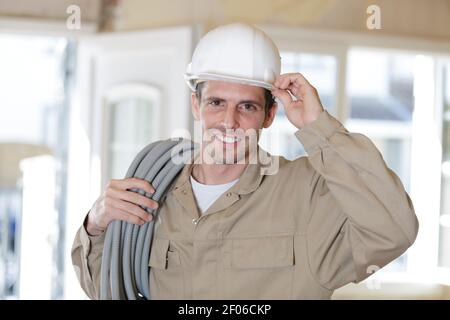 close up of electrician fitting wiring on construction site Stock Photo