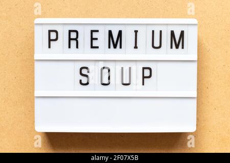 Lightbox with word premium soup on wood background Stock Photo