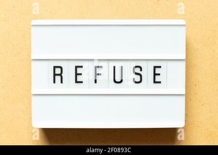 Lightbox with word refuse on wood background Stock Photo