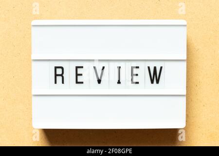 Lightbox with word review on wood background Stock Photo