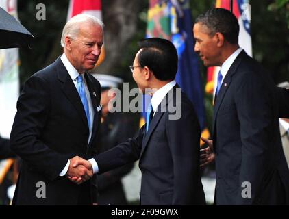 13 October 2011 - Washington, D.C. - U.S. Vice President Joe Biden greets South Korean President Lee Myung-bak as President Barack Obama watches during an arrival ceremony on the South Lawn at the White House in Washington, D.C. on October 13, 2011. Photo Credit: Kevin Dietsch/Pool/Sipa Press/1110141421