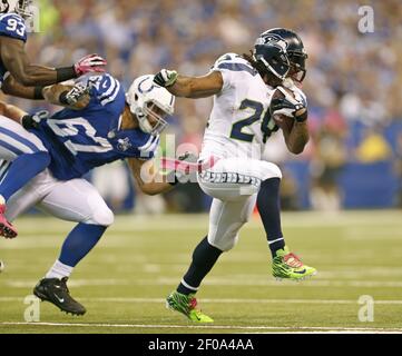 Green Bay, WI, USA. 12th Jan, 2020. Green Bay Packers cornerback Jaire  Alexander #23 rips the shirt of Seattle Seahawks running back Marshawn Lynch  #24 while a host of Packers make the