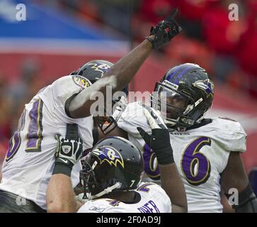 Buffalo Bills defensive tackle Marcell Dareus, center, passes Baltimore  Ravens tackle Michael Oher (74) to sack Ravens quarterback Joe Flacco (5)  during the second quarter at Ralph Wilson Stadium in Orchard Park