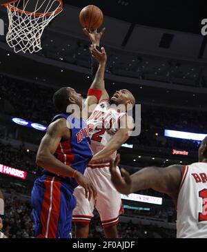 NO FILM, NO VIDEO, NO TV, NO DOCUMENTARY - Chicago Bulls small forward Luol  Deng (9) dunks in front of Detroit Pistons shooting guard Tracy McGrady (1)  in the second quarter during