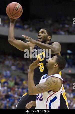 Virginia Commonwealth's Jamie Skeen, left, drives the ball as Kansas' Markieff  Morris defends during the second half at the Southwest regional final game  in the NCAA college basketball tournament on Sunday, March