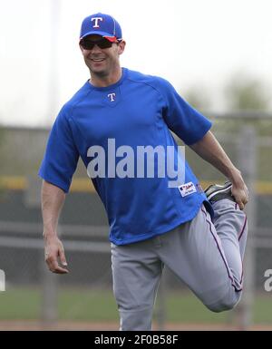 The Texas Rangers' Michael Young connects in the batting cage as teammate  Ian Kinsler looks on during spring training in Surprise, Arizona, Saturday  February 25, 2012. (Photo by Ron T. Ennis/Fort Worth