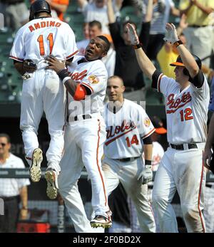 ADAM JONES AND ROBERT ANDINO.  Baltimore orioles, Tops, Sports jersey