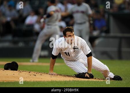 Chicago White Sox pitcher Philip Humber, left, chats with catcher A.J.  Pierzynski during the second inning against the Minnesota Twins in the  first baseball game of a double-header, Monday, Sept. 5, 2011