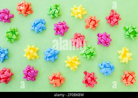Colorful bows on green Stock Photo