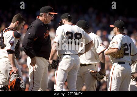 Former San Francisco Giants players Pablo Sandoval, left, and F.P.  Santangelo during a ceremony for longtime Giants clubhouse manager Mike  Murph Murphy being inducted into the team's Wall of Fame before a