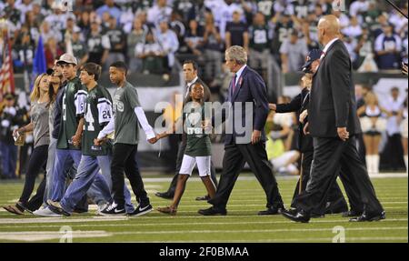 New England Patriots linebacker Monty Beisel, who wears the number of  former Patriot Ted Johnson, speaks with a young Johnson fan prior to their  game against the New York Jets at Gillette