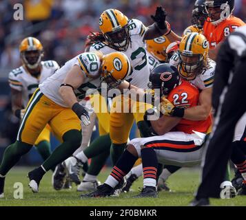 Green Bay Packers' AJ Hawk (50), Clay Matthews III (52) and Josh Sitton  (71) walk onto the field during NFL football practice on Wednesday, June  16, 2010, at Ray Nitschke Field in