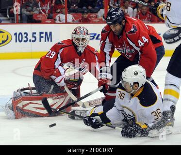 Buffalo Sabres' Patrick Kaleta, right, falls over New Jersey Devils' Vitaly  Vishnevski, of Ukraine, and goaltender Martin Brodeur, left, during the  third period of NHL hockey Tuesday, Jan. 8, 2008 at the