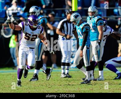 Minnesota Vikings Chad Greenway celebrates his 37 yard interception return  for a touchdown against the New York Giants in the fourth quarter with  teammates E.J. Henderson (56) and Ben Leber (51) at