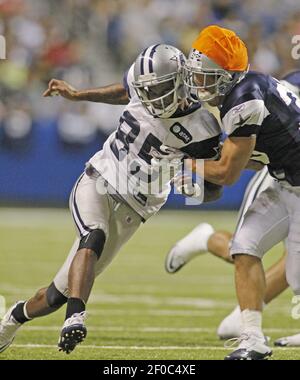 Dallas Cowboys FB Deon Anderson (34) can't keep Kansas City Chiefs  cornerback Maurice Leggett (31) from taking down Dallas Cowboys wide  receiver Kevin Ogletree (85) during the Cowboy's 26-20 victory over the