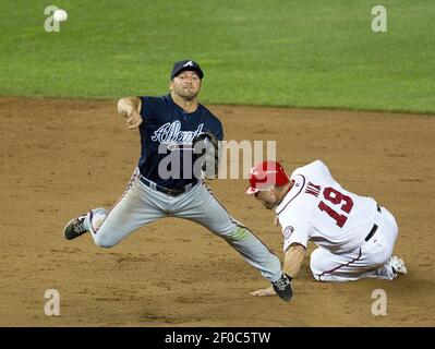 Los Angeles, USA. 8th June, 2013. Atlanta Braves second baseman Dan Uggla  #26 points as he crosses home after hitting a home run in the 5th inning  during the Major League Baseball