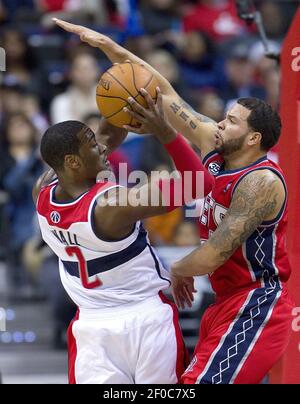 New Jersey Nets point guard Devin Harris (34) drives against Washington  Wizards guard Kirk Hinrich (12) during their game played at the Verizon  Center in Washington, D.C., Friday, January 7, 2011. (Harry