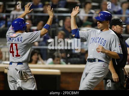 The Chicago Cubs' Anthony Rizzo, left, is congratulated by teammate Bryan  LaHair (6) following his two-run home run against the Houston Astros in the  fifth inning at Wrigley Field in Chicago, Illinois