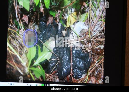 A photo entered in evidence is shown on a courtroom monitor during the ...