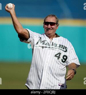 Former Florida Marlins Charlie Hough, left, and Benito Santiago, of Puerto  Rico, congratulate each other after Hough threw a ceremonial first pitch to  Santiago before the start of a baseball game between