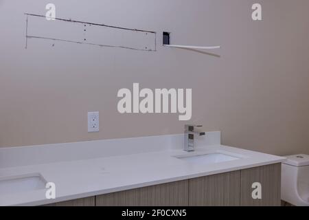 Modern marble countertop designer bathroom with sinks bathtub Stock Photo