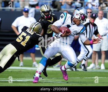 Photo: Carolina Panthers quarterback Cam Newton tackled by New Orleans  Saints linebacker Jonathan Vilma - CHP2011100921 