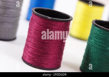 Spools of colorful thread as accessories for using in sewing and needlework Stock Photo