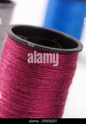 Spools of colorful thread as accessories for using in sewing and needlework Stock Photo