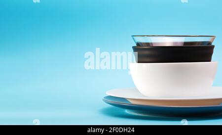 Different sizes and colors plates on blue background Stock Photo