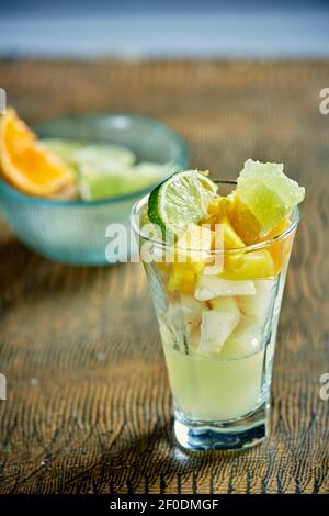 Set of different pieces fresh fruits in glass Stock Photo