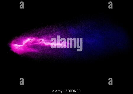 Abstract Blue Pink colored sand splash against  black background. Stock Photo