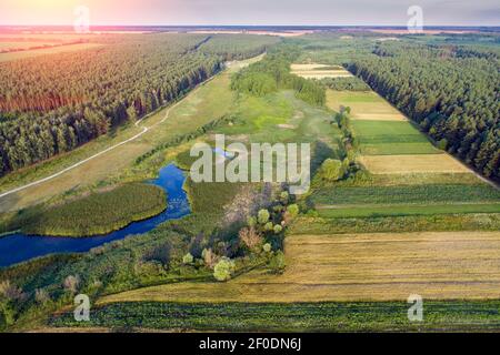 Top view of the rural landscape. View of colorful arable fields in summer