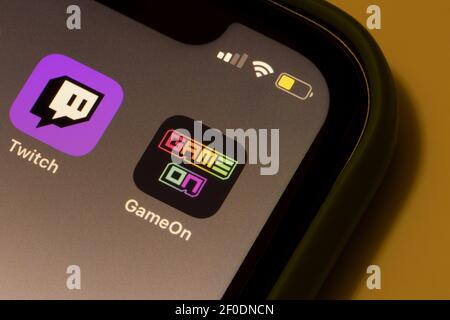 GameOn and Twitch app icons are seen on an iPhone. Amazon's newly-launched GameOn app seems to have features similar to that of both Twitch and TikTok. Stock Photo