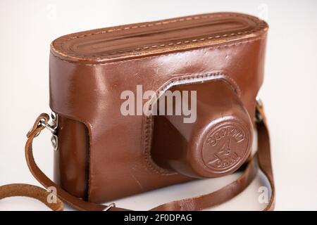 View of Russian Zorki 4 old vintage manual film camera with original brown leather case as classic retro photography concept. Stock Photo