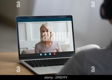 Woman talk on webcam call with elderly mother Stock Photo