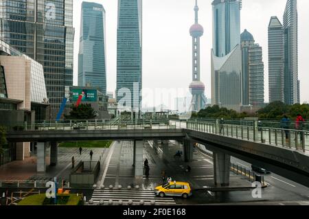 View from the skywalk near the Shanghai World Financial Center back towards the Oriental Pearl Tower in Shanghai’s Lujiazui, Pudong District, China on Stock Photo