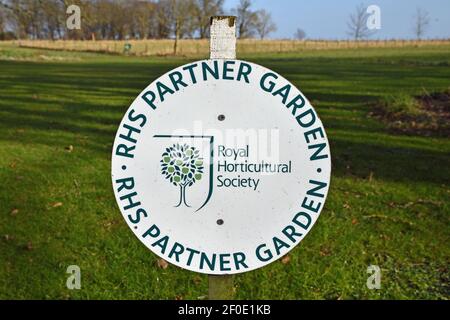 Royal Horticultural Society Partner Garden sign with grass background, sunny day with blue sky. Kellie Castle, Fife, Scotland, UK. Stock Photo