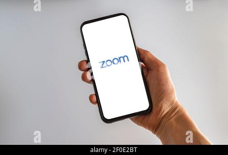 Meetings Cloud Zoom smart phone application that shows the logo. Online interview application logo in the corona virus era. Stock Photo